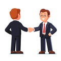 Two standing business man shaking hands firmly