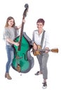 Two standing women with double bass and guitar Royalty Free Stock Photo