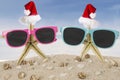 Two starfish with Santa hat and sunglasses Royalty Free Stock Photo