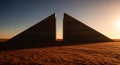 Two stark concrete monoliths divide the desert light Royalty Free Stock Photo