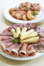 Two starter platters with smoked meat, cheese and shrimps Royalty Free Stock Photo