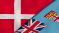 The flags of Denmark and Fiji. News, reportage, business background. 3d illustration