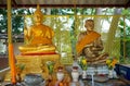 Two statues in a small temple in Hatyai, Thailand.