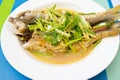 Two steamed mackerel fishes with ginger