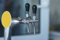 Two steaming taps for pouring beer. Close up Royalty Free Stock Photo