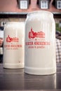 Two beer steins on a table at a monastery in Germany Royalty Free Stock Photo