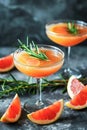 Two stem glasses filled with a refreshing grapefruit cocktail,