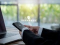 Two steps authentication 2FA concept. 2023, Shield and asterisk icons code showing on smart phone while using computer. Royalty Free Stock Photo