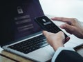 Two steps authentication 2FA concept. Shield icon and password code showing on smart phone screen?