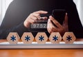 Two steps authentication or 2FA concept. Verification code numbers with key icon appear when businessman using smart phone for