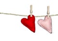 Two stitched hearts on a clothes line