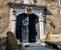 Two stone benches standing at the entrance gate