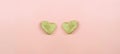 Two stone hearts  on pastel pink background .Feelings of stone heart for concept background .   Valentines Day card. Copy space Royalty Free Stock Photo