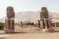 Two stone statues of Pharaoh Amenhotep III at Thebes Necropolis, Luxor, Egypt