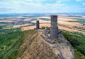 two stone towers, ruins of medieval castle Hazmburk, Hasenburg built on top of the mountain peak, Czech republic