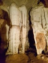 Two stones limestone chalk formation light middle in dark cave stalactite cave water river inside pai tour chiang mai Royalty Free Stock Photo