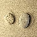 Two stones in the sand Royalty Free Stock Photo