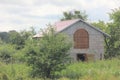 Two-storey goat house for keeping goats in rural conditions Royalty Free Stock Photo