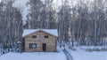 A two-storey log house on the edge of a birch grove. Royalty Free Stock Photo