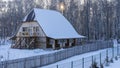 A two-storey wooden house on the edge of a birch grove. Royalty Free Stock Photo