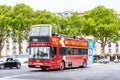 Two-storeyed tourist bus in the street of Paris