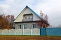 A two-storied house in a remote Russian village. typical village house in the countryside Royalty Free Stock Photo
