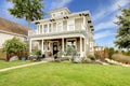 Two story american house with white column porch