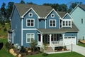 Two-story, blue, suburban home in a neighborhood in North Carolina