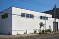 A two story, brick commercial building, painted white, in the Columbia Street Waterfront District of Brooklyn, NYC Royalty Free Stock Photo