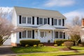 two-story colonial with evenly spaced windows under the sunlight Royalty Free Stock Photo