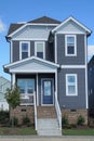 Two-story, gray, suburban home in a neighborhood in North Carolina