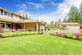 Two story house with attached garage and open column porch