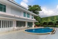 Two-story house with fence and swimming pool