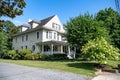 Two-story house in a traditional American style covered with siding