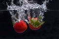 Two strawberries dropped in water Royalty Free Stock Photo