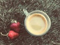 Two strawberrys on the grass with cup of coffee Royalty Free Stock Photo
