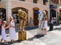 Two street actors in the image of living statues on the street Massena in the city Nice, France.