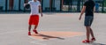 Two street basketball players playing one on one lot of close up action and guarding the ball Royalty Free Stock Photo