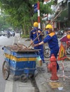 Two street cleaners are doing their work Royalty Free Stock Photo