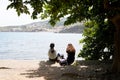 Two student girl relax in coast vermeille mediterranean beach in south coast Pyrenees Orientales in Languedoc-Roussillon France Royalty Free Stock Photo