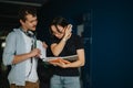 Two students discussing coursework in a hallway at university Royalty Free Stock Photo