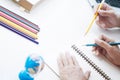 Two students doing homework together and helping each other sitting in a table at class room Royalty Free Stock Photo