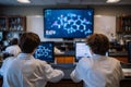 Two students in lab coats sit at a table in a chemistry lab, focused on their computers. An interactive display shows molecular Royalty Free Stock Photo