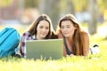 Two students learning on line with laptop Royalty Free Stock Photo