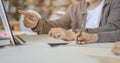 Two students are reading and discussing about exam preparation, presentation, study for test preparation in library Royalty Free Stock Photo