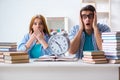 The two students runnng out of time to prepare for exams Royalty Free Stock Photo