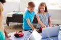 Two Students In After School Computer Coding Class Learning To Program Robot Vehicle Royalty Free Stock Photo