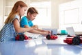 Two Students In After School Computer Coding Class Learning To Program Robot Vehicle Royalty Free Stock Photo