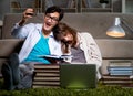 Two students studying late preparing for exams Royalty Free Stock Photo