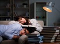 Two students studying late preparing for exams Royalty Free Stock Photo